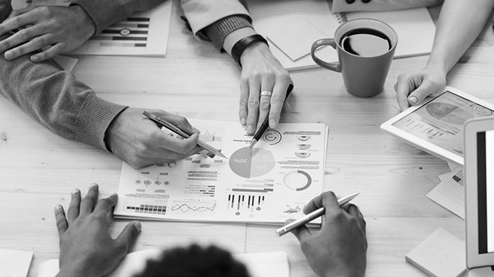 People reviewing a translated corporate document prepared by a global translation company